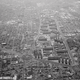 An island of high-rise apartments is surrounded by mid century urban sprawl